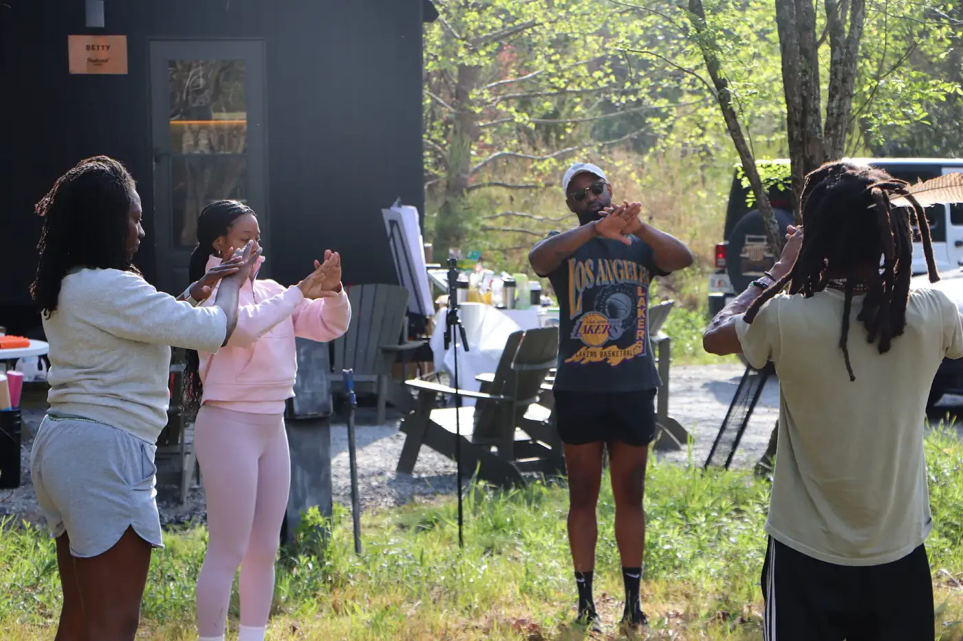 Women and community members taking part in an outdoor retreat activity