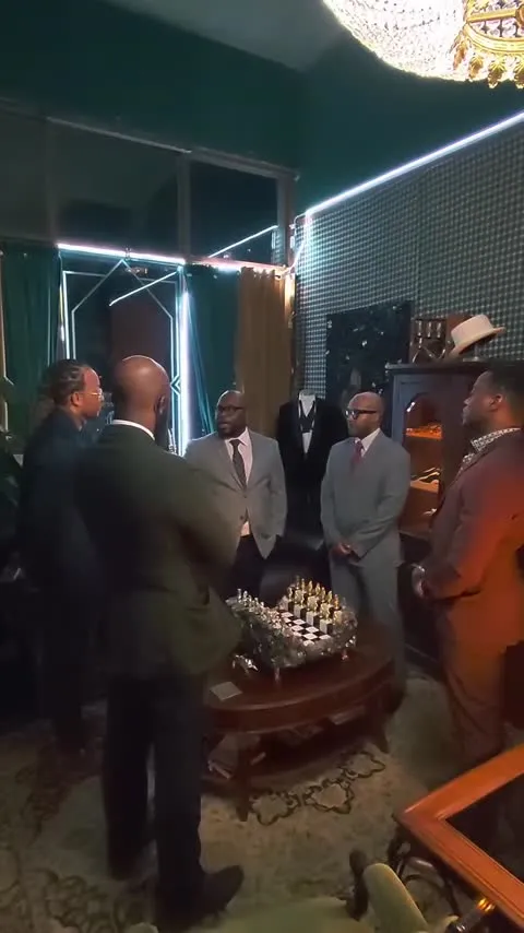 Men gathered for the Foundation’s Round Table Discussion around a chess table